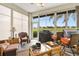 Enclosed lanai providing a relaxing space with comfortable seating and bright views at 12255 Se 177Th Loop, Summerfield, FL 34491