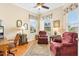 Cozy home office with hardwood floors and comfortable seating at 12255 Se 177Th Loop, Summerfield, FL 34491