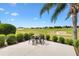 Picturesque patio features outdoor seating and a view of the verdant golf course beyond at 12255 Se 177Th Loop, Summerfield, FL 34491