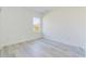 An empty bedroom with a neutral color palette and large window at 16890 Sw 39Th Cir, Ocala, FL 34473