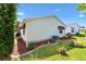 Well-maintained backyard with lush green grass and neat landscaping, enhanced by mulch and shrubbery at 1736 Watts Mill Way, The Villages, FL 32162