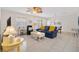 Bright living room featuring tile floors, recessed lights, and comfortable seating arrangement at 1736 Watts Mill Way, The Villages, FL 32162