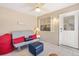 Cozy sunroom with tile flooring, bright lighting, and a comfortable seating area at 1736 Watts Mill Way, The Villages, FL 32162