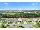 An aerial view of a well-manicured home with lush landscaping in a quiet neighborhood at 17902 Se 115Th Cir, Summerfield, FL 34491
