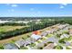 An aerial view showcases a well-kept home with surrounding community amenities and green landscape at 17902 Se 115Th Cir, Summerfield, FL 34491