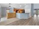 Bright kitchen with bar, and a seamless transition into the spacious living area at 17902 Se 115Th Cir, Summerfield, FL 34491