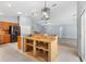 Modern kitchen featuring stainless appliances, a stylish bar, and an open concept design at 17902 Se 115Th Cir, Summerfield, FL 34491