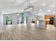 Spacious living room with vaulted ceilings, tile floors, and lots of natural light at 17902 Se 115Th Cir, Summerfield, FL 34491