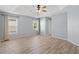 Bright main bedroom featuring wood-look floors, ample natural light, and neutral paint at 17902 Se 115Th Cir, Summerfield, FL 34491