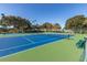 Beautiful community tennis courts surrounded by lush landscaping provide a great place to play at 17902 Se 115Th Cir, Summerfield, FL 34491