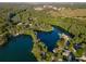 Breathtaking aerial view of a river and adjacent lakes surrounded by green trees and fields at 19938 Burkitt Rd, Dunnellon, FL 34432