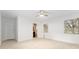 Bedroom featuring neutral walls and floors, and a door to an ensuite bathroom at 19938 Burkitt Rd, Dunnellon, FL 34432