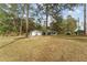 Charming single-story home with a two-car garage and surrounded by mature trees at 19938 Burkitt Rd, Dunnellon, FL 34432