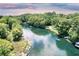 Picturesque view of a clear river, perfect for boating and enjoying the surrounding nature at 19938 Burkitt Rd, Dunnellon, FL 34432