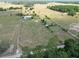 Expansive aerial view of horse property featuring perimeter fencing, paddocks and lush surroundings at 258 Nw 122Nd Ave, Oxford, FL 34484