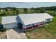 Expansive property featuring a bright home with a metal roof and beautiful surrounding land at 258 Nw 122Nd Ave, Oxford, FL 34484