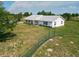 Lovely home with a metal roof on a well-manicured lot with a fenced pasture at 258 Nw 122Nd Ave, Oxford, FL 34484