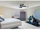 Bedroom featuring a window overlooking green pastures, along with exercise equipment and a ceiling fan at 258 Nw 122Nd Ave, Oxford, FL 34484
