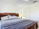 Bedroom with a large bed, closet, and ceiling fan at 258 Nw 122Nd Ave, Oxford, FL 34484