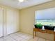 Bedroom with a window offering views of greenery and a closet for ample storage space at 258 Nw 122Nd Ave, Oxford, FL 34484