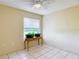 Bright bedroom with a charming table under the window, perfect for displaying plants and decor at 258 Nw 122Nd Ave, Oxford, FL 34484