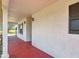 Outdoor covered porch with decorative sconces and a view at 258 Nw 122Nd Ave, Oxford, FL 34484