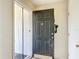 A look at the home's front door with a screen door at 258 Nw 122Nd Ave, Oxford, FL 34484