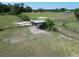View of a horse in a shelter in a lush green field at 258 Nw 122Nd Ave, Oxford, FL 34484