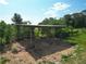 View of an open horse shelter with a wood frame at 258 Nw 122Nd Ave, Oxford, FL 34484