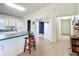 View from living area towards kitchen and entryway featuring tile floors at 258 Nw 122Nd Ave, Oxford, FL 34484