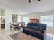 View of the living room and dining area with tile floors at 258 Nw 122Nd Ave, Oxford, FL 34484