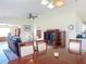 Open-concept living room and dining area with lots of natural light and tile floor at 258 Nw 122Nd Ave, Oxford, FL 34484