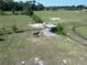 Horse stands in a field, near a shelter and a fence at 258 Nw 122Nd Ave, Oxford, FL 34484