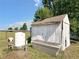The backyard features a white, weather shed with a tank and toolbox at 258 Nw 122Nd Ave, Oxford, FL 34484