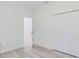 Bright bedroom with a closet and light wood-look floors that add a touch of warmth at 2627 Sw 154Th Place Rd, Ocala, FL 34473