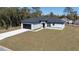 New construction showcasing modern design, landscaping, and a two-car garage at 2627 Sw 154Th Place Rd, Ocala, FL 34473