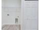 Laundry room including washer and dryer hookups and a storage shelf at 2627 Sw 154Th Place Rd, Ocala, FL 34473