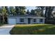Charming single-story home with a well-maintained lawn and a classic, inviting facade at 267 Oak Lane Trak, Ocala, FL 34472