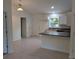 Open-concept kitchen with a breakfast bar, ample counter space, and modern lighting at 267 Oak Lane Trak, Ocala, FL 34472
