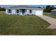 Charming single-story home featuring a well-maintained lawn and attached garage at 2803 Sw 147Th Ct, Ocala, FL 34481