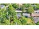 Aerial view of homes amid lush greenery, nearby a road and other structures, enhancing privacy at 426 Sw 13Th St, Ocala, FL 34471