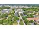 Wide aerial shot featuring a residential area near commercial properties and busy roads, nestled within a green landscape at 426 Sw 13Th St, Ocala, FL 34471