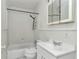 The bathroom has a shower-tub combo, toilet, and vanity with a sink, all finished in white at 426 Sw 13Th St, Ocala, FL 34471
