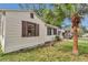 Single story home featuring a yard and an attached garage, showcasing a well-maintained exterior at 426 Sw 13Th St, Ocala, FL 34471