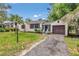 Beautiful single-story home with a well-kept lawn, and attached garage, exemplifying suburban charm at 426 Sw 13Th St, Ocala, FL 34471