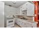 Compact kitchen includes an oven, sink, and plenty of storage at 426 Sw 13Th St, Ocala, FL 34471