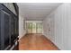 Spacious sunroom with paneled walls, wood floors, and natural light at 426 Sw 13Th St, Ocala, FL 34471