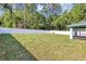 Large fenced backyard with lush green grass and privacy, perfect for outdoor activities at 4314 Se 131St Ln, Belleview, FL 34420