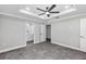 This bedroom features an ensuite bathroom and a ceiling fan at 4314 Se 131St Ln, Belleview, FL 34420