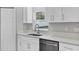 Quartz countertops and stainless dishwasher are some of the features of this kitchen at 4314 Se 131St Ln, Belleview, FL 34420
